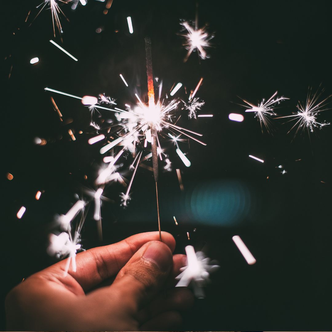 Holding a lit sparkler
