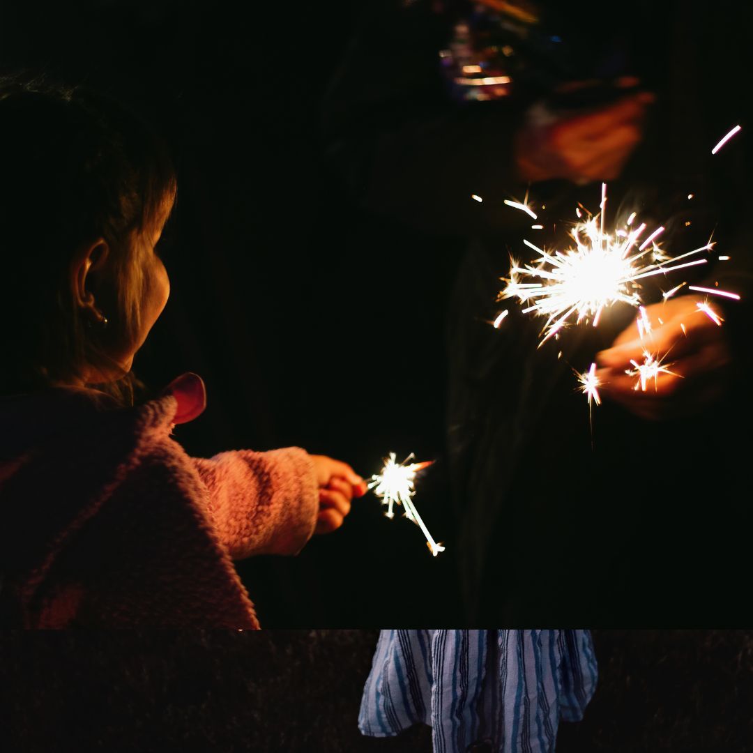 Small child holding a sparkler